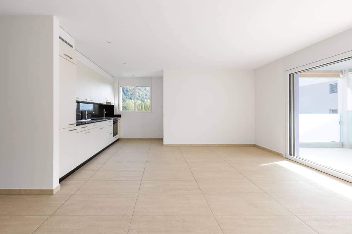 clean travertine floors in empty room