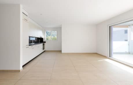 clean travertine floors in empty room